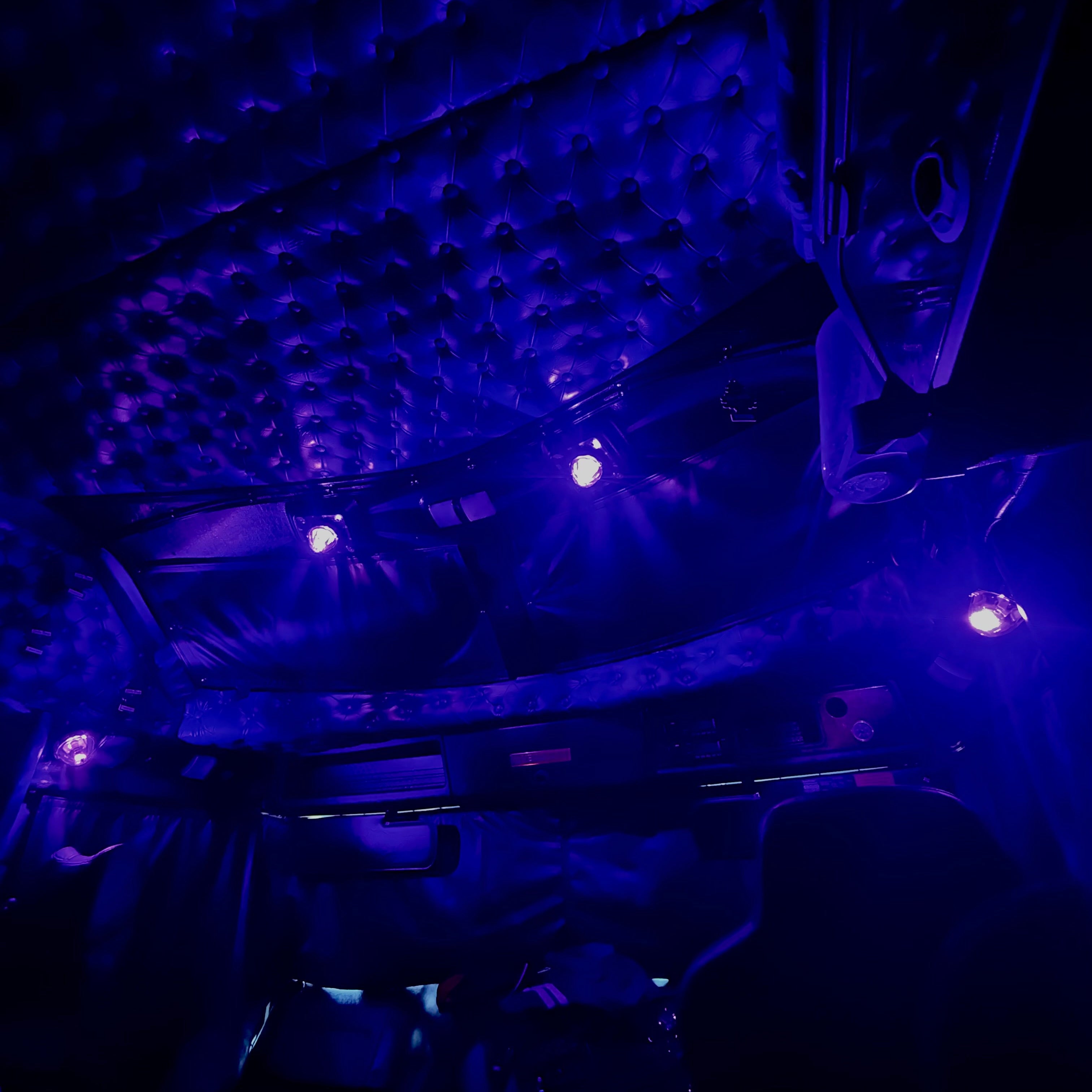 K200 kenworth interior showcasing 4 1156/1157 mounted glass watermelon lights illuminating in purple glow